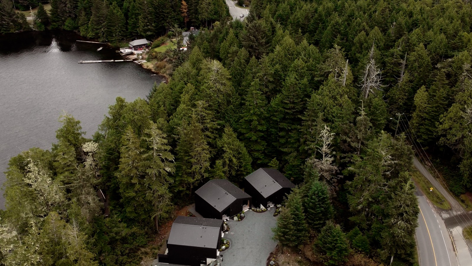 Aerial of Calmwater Retreat among the rainforest at the water's edge